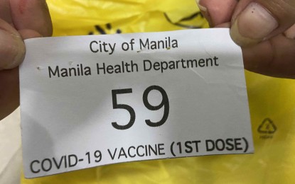 <p><strong>BY APPOINTMENT.</strong> Each village in Manila now distributes appointment stubs for Covid-19 vaccination. Residents lauded the city government for finally getting rid of the walk-in policy that resulted in long queues and disregard for basic health protocols, especially physical distancing. <em>(Photo courtesy of Manila PIO)</em></p>