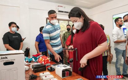 <p><strong>WARNING DEVICES.</strong> Cantilan, Surigao del Sur Mayor Carla Lopez-Pichay on Wednesday (Aug 11, 2021) leads the installation of the early warning devices that will aid the local government in the monitoring of natural and human-induced hazards in the area. The warning devices, including CCTV cameras, cost PHP2.5 million.<em> (Photo courtesy of Cantilan LGU Facebook Page)</em></p>
