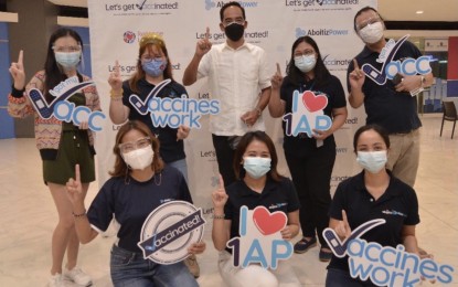 <p><strong>VACCINATION.</strong> AboitizPower president and chief executive officer Emmanuel Rubio (center) poses with other employees who received Covid-19 vaccines. Rubio on Friday (Aug. 13, 2021) expressed the firm’s commitment to helping the government reach its target of vaccinating a majority of the population by ramping up its inoculation of its employees.<em> (Photo courtesy of AboitizPower)</em></p>