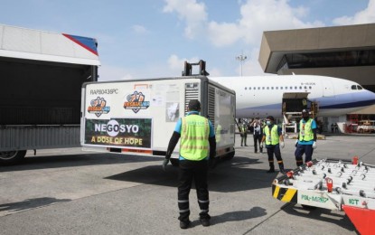 <p><strong>PRIVATE PROPERTY.</strong> The shipment of 575,800 doses of the Covid-19 vaccine AstraZeneca arrives at the Ninoy Aquino International Airport Terminal 1 in Pasay City on Friday (Aug. 13, 2021). The private sector in the National Capital Region will receive most of the jabs. <em>(PNA photo by Avito Dalan)</em></p>