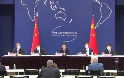 <p><strong>ORIGIN-TRACING</strong>. Chinese Vice Foreign Minister Ma Zhaoxu (center) briefs members of the diplomatic corps in China on Covid-19 origin-tracing at the Chinese Foreign Ministry on Friday (Aug. 13, 2021). The briefing was attended by more than 160 diplomatic envoys and representatives of international organizations in China. <em>(Contributed photo)</em></p>