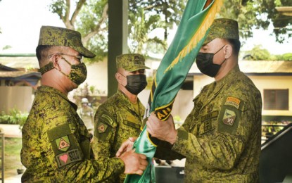 <p><strong>RESHUFFLE.</strong> Maj. Gen. William Gonzales, 11ID commander (right), installs Col. Govani Franza, the 11ID Assistant Division Commander for Retirees and Reservist Affairs (left), as the new commander of the 1102nd Infantry Brigade, replacing Brig. Gen. Benjamin Batara (center), who was reassigned to lead the 1103rd Infantry Brigade. The Army's 11th Infantry Division (ID) reshuffled its key officers effective Tuesday (Aug. 17, 2021) to strengthen the anti-terror campaign in the province of Sulu. <em>(Photo courtesy of the 11ID Public Affairs Office)</em></p>