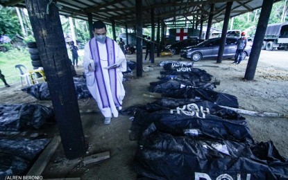 <p><strong>FATALITIES</strong>. A priest blesses the corpses of New People's Army (NPA) rebels killed in a recent encounter in Dolores, Eastern Samar in this Aug. 18, 2021 photo. The Philippine Army has recovered three more bodies, bringing the number of fatalities to 19, a top military official said on Thursday (Aug. 19, 2021). <em>(Photo courtesy of Alren Beronio)</em></p>