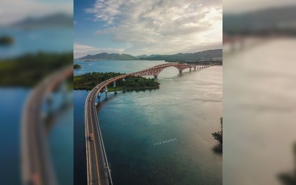 <p><strong>LIGHTS CAN WAIT</strong>. An aerial view of San Juanico Bridge connecting the islands of Leyte and Samar. The rehabilitation of the San Juanico Bridge has further delayed the much-awaited aesthetic lighting project, the Department of Tourism said on Friday (Aug. 20, 2021). <em>(Photo courtesy of Lyle Arañas)</em></p>