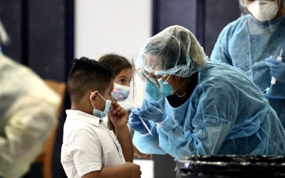 <p><strong>NOT FUN.</strong> A student of Montara Avenue Elementary School in Los Angeles, California undergoes a Covid-19 test on Aug. 16, 2021. The Centers for Disease Control and Prevention reported a peak in infection in the under-18 age group. <em>(Xinhua)</em></p>