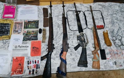 <p><strong>SEIZED FIREARMS.</strong> Four suspected members of the Communist Party of the Philippines-New People's Army yield assorted firearms during their arrest in Sta. Catalina, Negros Oriental on Aug. 18, 2021. The Philippine Army said the four belonged to the defunct Lokal Guerilla Unit of the South Eastern Front. <em>(Photo courtesy of the Philippine Army)</em></p>