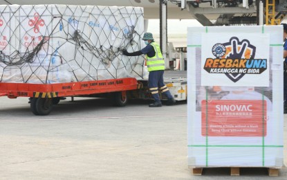 <p><strong>JABS.</strong> A Philippine Airlines flight lands with 1 million doses of Sinovac jabs at the Ninoy Aquino International Airport Terminal 2 in Pasay City on Saturday (Aug 21, 2021). The government aims to inoculate as many as 700,000 daily depending on supplies. <em>(PNA photo by Robert Oswald P. Alfiler)</em></p>