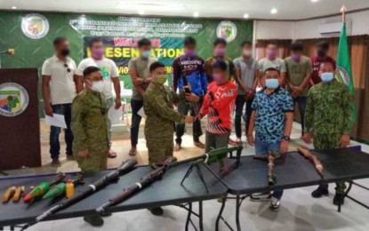 <p><strong>NEW LIFE.</strong> Military and local officials of Datu Saudi Ampatuan, Maguindanao accept the surrender of 10 BIFF extremists during simple ceremonies held at the camp of the Army’s 1st Mechanized Brigade in Ampatuan town on Tuesday (Aug. 24, 2021). The surrenderers, who also yielded assorted firearms, are assured of livelihood packages under the AGILA-HAVEN program of the provincial government. <em>(Photo courtesy of 6ID)</em></p>