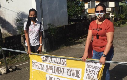 <p><strong>ONE ENTRY, ONE EXIT</strong>. Antique Liga ng mga Barangay president Pamela Socorro Azucena (right) implements the "one entry, one exit" in Barangay Idio, Sebaste to discourage people from going out of their homes. She said on Thursday (Aug. 26, 2021) she will call for a meeting with other barangay leaders in the province's 18 towns to discuss the uniform the Covid-19 health protocols. <em>(Photo courtesy of LnB Antique)</em></p>