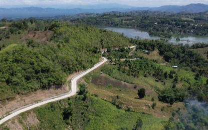 <p><strong>TOURISM ROAD</strong>. The aerial view of the portion of the PHP120 million access road leading to tourist destinations in Lake Sebu under the Tourism Road Infrastructure Project, a convergence initiative of the Department of Public Works and Highways and the Department of Tourism. The 5.213-km project starts from the junction of Ben Sidon Bacdulong road leading to the Lake Sebu circumferential road in Barangay Bacdulong, Lake Sebu. (<em>Photo courtesy of DPWH-12</em>) </p>