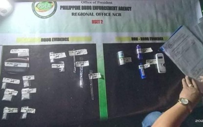 <p><strong>BUY-BUST.</strong> Antipolo cops show seized shabu and other paraphernalia from seven suspects arrested in Barangay Cupang at about 7 p.m. on Aug. 21, 2021. The confiscated items include a coin purse, lighters, mobile phone, PHP1,000 marked money, and about 20 grams of shabu with a street value of PHP136,000. <em>(Photo courtesy of Antipolo PNP Facebook)</em></p>