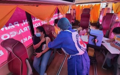 <p><strong>BAKUNA BUS.</strong> The Philippine Red Cross vaccination bus goes to Calatagan, Batangas to inoculate 500 residents with the first dose of Sinovac in this August 2021 photo. The schedule may be arranged by calling hotline 1158.<em> (Photo courtesy of PRC)</em></p>