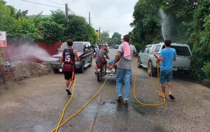 <p><strong>CITY-WIDE.</strong> Village officials lead the two-day cleanup and disinfection activities in Tuguegarao City on Sunday (Aug. 29, 2021). The city confirmed seven new cases of the Delta variant on Monday (Aug. 30).<em> (Contributed photo)</em></p>