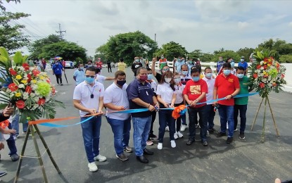 <p><strong>OPENING</strong>. Henry Alcantara, district engineer of the DPWH-Bulacan 1st District Engineering Office (third from left), together with some local officials, leads the formal opening of the new Tabang Bridge in Guiguinto, Bulacan on Tuesday (Aug. 31, 2021). The reconstruction of the 40-year-old bridge started in January 2021 for a total cost of PHP30 million.<em> (Photo by Manny Balbin)</em></p>
<p> </p>