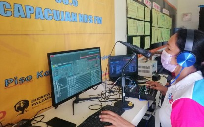 <p><strong>LEARNING THROUGH THE RADIO</strong>. A teacher in Capacujan National High School in Palapag, Northern Samar operates a piece of equipment during a test broadcast in this Aug. 31, 2021 photo. About 800 learners in remote villages in Palapag town stand to benefit from the Radio Based Instruction (RBI) project funded through donations raised by a non-government organization. <em>(Photo courtesy of Humanitarian Order of Sierra Falconès, Inc.)</em></p>