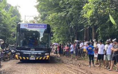 <p><strong>VACCINATION DRIVE</strong>. One of the "Bakuna" buses of the Philippine Red Cross arrives in a remote village in Tanay, Rizal. The PRC health workers vaccinated Covid-19 priority groups in the area. <em>(Photo courtesy of PRC)</em></p>