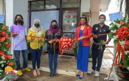 <p><strong>TOURISM HUB.</strong> The city government of Isabela, the capital of Basilan province, launches on Thursday (Sept. 2, 2021) the "HAPIsabela Tourism Assistance Center" as part of its program to boost the local tourism industry. The launch of the center was led by Mayor Sitti Djalia Turabin-Hataman (3rd from left) and Department of Tourism (DOT) Undersecretary Myra Paz Valderossa-Abubakar (2nd from right). <em>(Photo courtesy of the DOT regional office)</em></p>