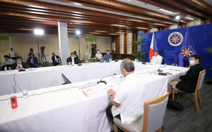 <p><strong>QUARANTINE.</strong> President Rodrigo Roa Duterte presides over a meeting with the Inter-Agency Task Force for the Management of Emerging Infectious Diseases (IATF-EID) core members prior to his talk to the people in Davao City on Sept. 2. Malacañang said on Sunday (Sept. 5, 2021) Duterte is yet to approve “new quarantine responses, including possible granular lockdowns in Metro Manila. <em>(Presidential photo)</em></p>