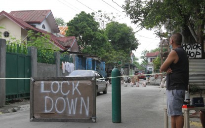 <p><strong>LOCKED DOWN.</strong> A street at Parklane Subdivision in Barangay San Francisco, General Trias City, Cavite is under granular lockdown due to several households reporting Covid-19 cases on Sunday (Sept. 5, 2021). Barangay San Francisco accounts for 93 of General Trias’ 617 active Covid-19 cases as of Sept. 4, the most in the city.<em> (PNA photo by Avito C. Dalan)</em></p>