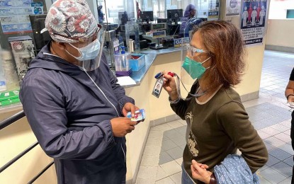 <p><strong>FREE RIDE.</strong> An authorized person outside residence shows her identification card to avail of a free ride at the Metro Rail Transit-3 on Sept. 1. Qualified riders must also show their vaccination cards to avail of the incentive until Tuesday (Sept. 7, 2021) from 7 a.m. to 9 a.m. and 5 p.m. to 7 p.m. <em>(Photo courtesy of MRT-3 Facebook)</em></p>