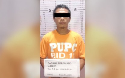 <p><strong>CHARGED.</strong> Ferdinand Aque Dagium, a barangay kagawad from Magsaysay, Sibagat, Agusan del Sur, is among the three couriers arrested while transporting ammunition, grenades and food supplies for the NPA rebels last Sept. 3 in Pianing, Butuan City. Dagium and his companions were formally charged on Monday (Sept. 7, 2021). <em>(Photo courtesy of PRO-13 Information Office)</em></p>