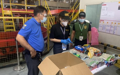 <p><strong>BAD PACKAGE.</strong> Customs officers intercept a package containing 1.8 kilograms of kush or high-grade marijuana worth over PHP2 million at the BOC-Port of NAIA. A controlled delivery operation on Tuesday (Sept. 7, 2021) led to the arrest of Arthur Antonio, the consignee of the package.<em> (Photo courtesy of BOC-NAIA)</em></p>