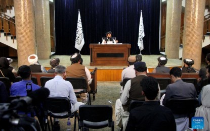 <p><strong>CARETAKER GOV’T.</strong> Taliban spokesman Zabihullah Mujahid (Rear) speaks during a press conference in Kabul, Afghanistan, on Sept. 7, 2021. The Taliban announced on Tuesday night the formation of Afghanistan's caretaker government, with Mullah Hassan Akhund appointed as the acting prime minister. <em>(Photo by Saifurahman Safi/Xinhua)</em></p>