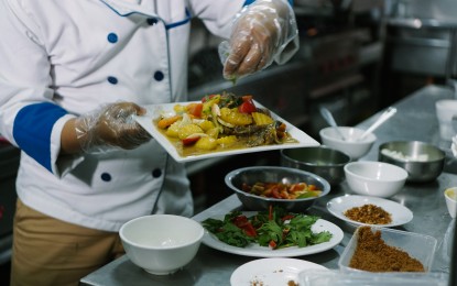 <p>A hearty Halal dish is about to be served in Tambilawan Kamayan Restaurant in General Santos City. <em>(Photo courtesy of the Department of Tourism)</em></p>