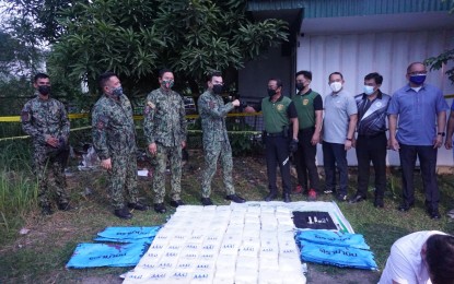 <p><strong>HUNT CONTINUES.</strong> Philippine National Police (PNP) chief, Gen. Guillermo Eleazar (4th from left), and PDEA Director General Wilkins Villanueva (5th from right) do a fist bump during the recovery of another 80 kilograms of shabu worth around PHP544 million in a follow-up operation in Hermosa, Bataan on Tuesday afternoon (Sept. 7, 2021). The operation was conducted hours after a buy-bust operation in Candelaria, Zambales that resulted in the death of 4 Chinese drug suspects and recovery of around 500 kilograms of shabu worth PHP3.4 billion. <em>(Photo courtesy of PRO-3)</em></p>