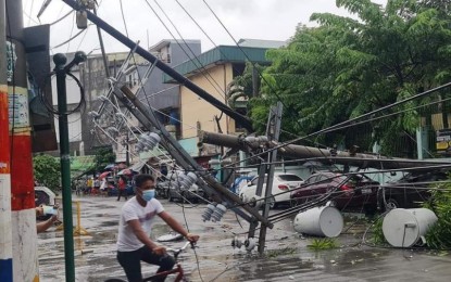 <p><strong>POWER OUTAGES</strong>. An electric post blocks Pampanga St. in Tondo, Manila on Sept. 8, 2021 as Metro Manila is placed under Signal No.2 due to Typhoon Jolina. The typhoon has caused power interruptions in the southern part of Luzon and Samar. <em>(Photo courtesy of Allen See)</em></p>