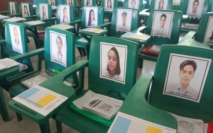 <p><strong>READY FOR SCHOOL.</strong> The classroom of Grade 9-Blueberry of the Calinog National Comprehensive High School in Iloilo province is ready for the opening of classes on Monday (Sept. 13, 2021). Class adviser Jessie Comprendio put the photos of his learners on chairs so he could identify them should they chance upon each other, as face-to-face classes remain suspended. <em>(Photo courtesy of Jessie S. Comprendio)</em></p>