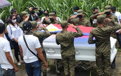 <p><strong>FUNERAL HONORS.</strong> Troops of the Philippine Army render their final salute to Pfc. Christopher Alada during his interment at the Badiangan, Iloilo public cemetery on Saturday (Sept. 11, 2021.) Alada and two New People’s Army rebels died during an encounter in Silay City, Negros Occidental on Aug. 20. (Photo courtesy of 79IB)</p>