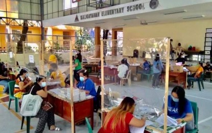 <p><strong>NEW SCHOOL YEAR.</strong> Kaligayahan Elementary School in Novaliches Quezon City distributes computer tablets on Sunday (Sept. 12, 2021). Since last year, the city has already purchased 191,000 units to support distance learning as the Covid-19 pandemic continues to halt face-to-face classes. <em>(Photo courtesy of QC Government Facebook)</em></p>