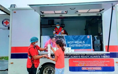 <p>Philippine Red Cross food truck distributes hot meals to Sta.Ana Cagayan affected by Typhoon Kiko. <em>(Photo courtesy of PRC)</em></p>