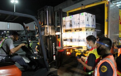 <p><strong>MORE PFIZER VAX.</strong> The Pfizer vaccine doses inside these boxes are carried by a forklift onto a reefer van at the NAIA in Pasay City on Wednesday (Sept. 15, 2021). A total of 65 million doses of vaccines against coronavirus disease 2019 have arrived since February this year and more are expected to arrive before yearend. <em>(PNA photo by Avito C. Dalan)</em></p>