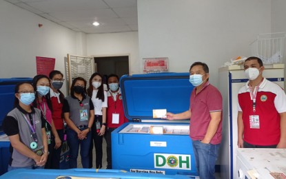 <p><strong>ANNIVERSARY GIFT.</strong> Zamboanga del Sur Gov. Victor Yu (second from right) holds a box containing Sinovac Covid-19 vaccine doses that arrived at the Pagadian City Airport on Thursday (Sept. 16, 2021). The shipment containing 10,000 doses of the Chinese-made vaccine arrived ahead of the celebration of the province's 69th founding anniversary on Friday. <em>(Photo courtesy of Zamboanga del Sur provincial government)</em></p>