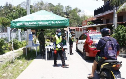 <p><strong>BORDER CONTROL.</strong> A Cagayan de Oro village checks the entry of motorists in this August 2021 photo. The province is among the first in the country to implement granular lockdowns to contain the spread of Covid-19 cases. <em>(Photo courtesy of CDO Official Facebook)</em></p>
