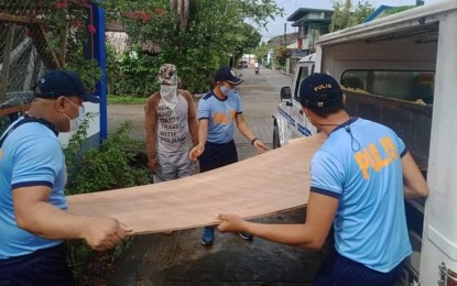 <p><strong>REBUILDING.</strong> Hinatuan Municipal Police Station members join hands to rebuild the house of Diosdado Saratao, a fisherman from the coastal barangay of La Casa, on Thursday (Sept. 16, 2021). The rebuilding is part of the Barangayanihan Help and Food Bank Program and Adopt a Family Program of the Philippine National Police. <em>(Photo courtesy of HMPS)</em></p>