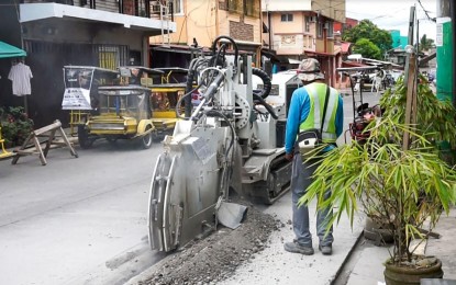<p><strong>NETWORK UPGRADES</strong>. A Converge lineman uses micro-trenching to install communication infrastructure in this undated photo. Converge CEO Dennis Uy on Wednesday (Sept. 22, 2021) said the company's fiber network is now "completely redundant" in North Luzon. <em>(Photo courtesy of Converge)</em></p>