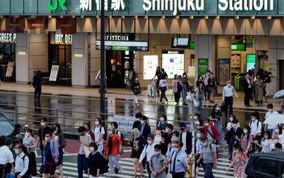 <p>Pedestrians walk across a street in Tokyo, Japan on July 8, 2021. (<em>Photo by Christopher Jue/Xinhua</em>) </p>