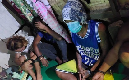 <p><strong>DRUG DEN.</strong> Three of the five people arrested in a search warrant operation conducted by the Philippine Drug Enforcement Agency and the police in Sitio Bagong Dalan, Barangay Talon-Talon, Zamboanga City on Monday (Sept. 27, 2021). Seized during the operation were about 15 grams of suspected shabu with an estimated street value of PHP102,000, two smartphones, and several illegal drug paraphernalia. <em>(Photo courtesy of PDEA-9)</em></p>