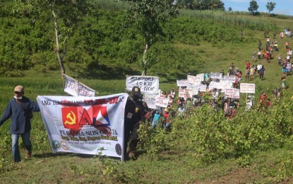 <p><strong>PEACE RALLY</strong>. Some 120 residents of Barangay Tabu in Ilog, Negros Occidental hold a peace walk while carrying placards condemning the atrocities and the extortion activities of the CPP-NPA-NDF, which they also declared persona non grata, on Sept. 23, 2021. They held the peace rally almost 10 days after a clash in the village that led to the death of four NPA rebels and the wounding of two others. <em>(Photo courtesy of 15th Infantry Battalion, Philippine Army)</em></p>