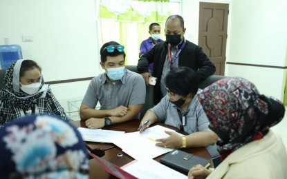 <p><strong>ASSESSMENT.</strong> Officials of the Civil Aviation Authority of the Philippines (CAAP) and the Bangsamoro Airport Authority of the Ministry of Transportation and Communications-Bangsamoro Autonomous Region in Muslim Mindanao discuss on Thursday (Sept. 30, 2021) the landside facilities of the Awang airport in Maguindanao that will be devolved to the Bangsamoro region. The airside functions of the airport will remain with CAAP. <em>(Photo courtesy of Bangsamoro Information Office–BARMM)</em></p>