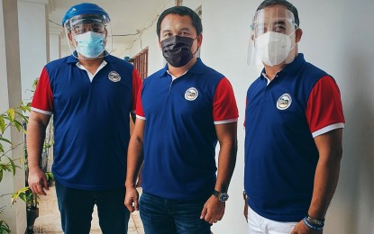 <p><strong>‘THE BIG THREE.’</strong> Sarangani province’s touted “big three” – (from left) outgoing Governor Steve Chiongbian Solon, Rep. Rogelio Pacquiao, and Vice Governor Elmer de Peralta – pose in front of supporters before filing their certificates of candidacies under the ruling local political party People’s Champ Movement on Friday (Oct. 1, 2021). Solon is seeking the province’s lone congressional seat while Pacquiao and de Peralta are running for governor and vice governor, respectively.<strong> </strong>(<em>Photo grabbed from the Facebook page of Vice Gov. De Peralta</em>) </p>