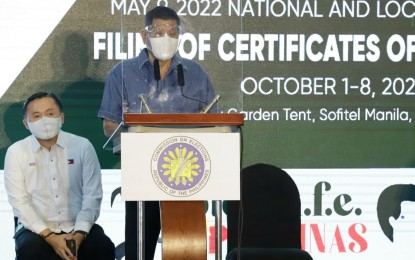 <p><strong>VP SUPPORTER.</strong> President Rodrigo Duterte (center) delivers a speech during the filing of Senator Christopher “Bong” Go’s candidacy for Vice President at the Sofitel Harbor Garden Tent in Pasay City on Saturday (Oct. 2, 2021). Partido Demokratiko Pilipino - Lakas ng Bayan president and Energy Secretary Alfonso Cusi (not in photo) also came.<em> (PNA photo by Robert Oswald P. Alfiler)</em></p>