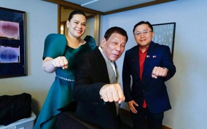 <p><strong>2022 BETS.</strong> Davao City Mayor Sara Duterte (left) and Senator Bong Go will run as president and vice president, respectively, under the same ticket, according to President Rodrigo Duterte in an ambush interview at the Sofitel Manila hotel in Pasay City on Saturday (Oct. 2, 2021). The photo was taken prior to the enthronement ceremony of Japanese Emperor Naruhito in October 2019. <em>(Presidential photo)</em></p>