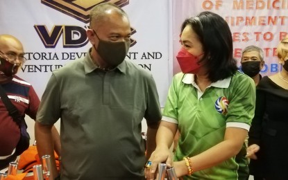 <p><strong>MEDICAL AID</strong>. Philippine Charity Sweepstakes Office (PCSO) General Manager Royina Garma (right) talks with Balangkayan, Eastern Samar Mayor Allan Contado during a gathering in Tacloban City on Monday (Oct. 4, 2021). The PCSO distributed PHP1.46 million worth of medicines, equipment, and medical supplies to 23 towns in Eastern Samar province.<em> (PNA photo by Sarwell Meniano)</em></p>