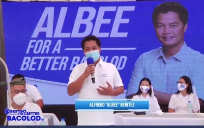 <p><strong>CHALLENGER.</strong> Former Negros Occidental 3rd district Rep. Alfredo “Albee” Benitez (standing) is challenging the reelection bid of Mayor Evelio Leonardia in Bacolod City in the May 2022 elections. In a press conference on Tuesday (Oct. 5, 2021), Benitez and his running mate, former councilor Caesar Distrito (seated, left), presented their slate composed of 12 candidates for councilor after filing their certificates of candidacy under the Team Asenso Bacolod. <em>(Screenshot from Albee Benitez Facebook Live video)</em></p>