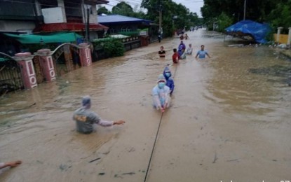 <p><strong>RESCUE OPERATIONS</strong>. Authorities and volunteers rescue residents of Luna town in La Union province on Tuesday (Oct. 12, 2021). Severe Tropical Storm Maring caused flooding in several towns of the province. <em>(Photo courtesy of La Union Police Provincial Office)</em></p>