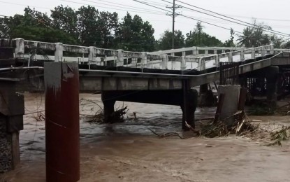 <p><strong>COLLAPSED</strong>. The Bayugao bridge in Santa Cruz, Ilocos Sur collapsed due to flooding on Tuesday (Oct. 12, 2021). Motorists are advised to take the Barangay Sidaoen-Amarao-Babayoan-Lalong-Sagat detour road. (<em>Photo courtesy of DPWH</em>) </p>